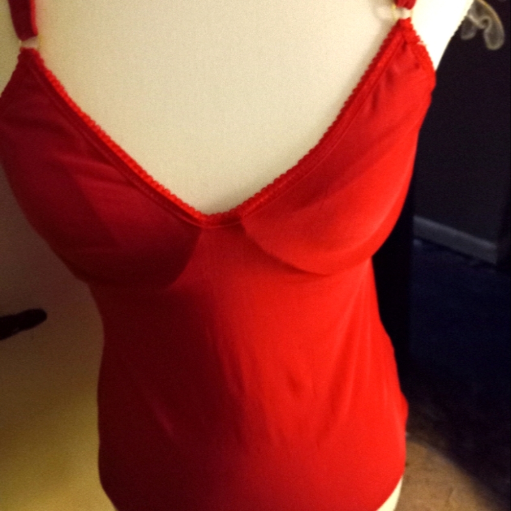 Used,not new red camisole with underwire shelf bra size 34c. Has wide straps.